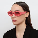 The Attico Berta Oval Sunglasses in Coral